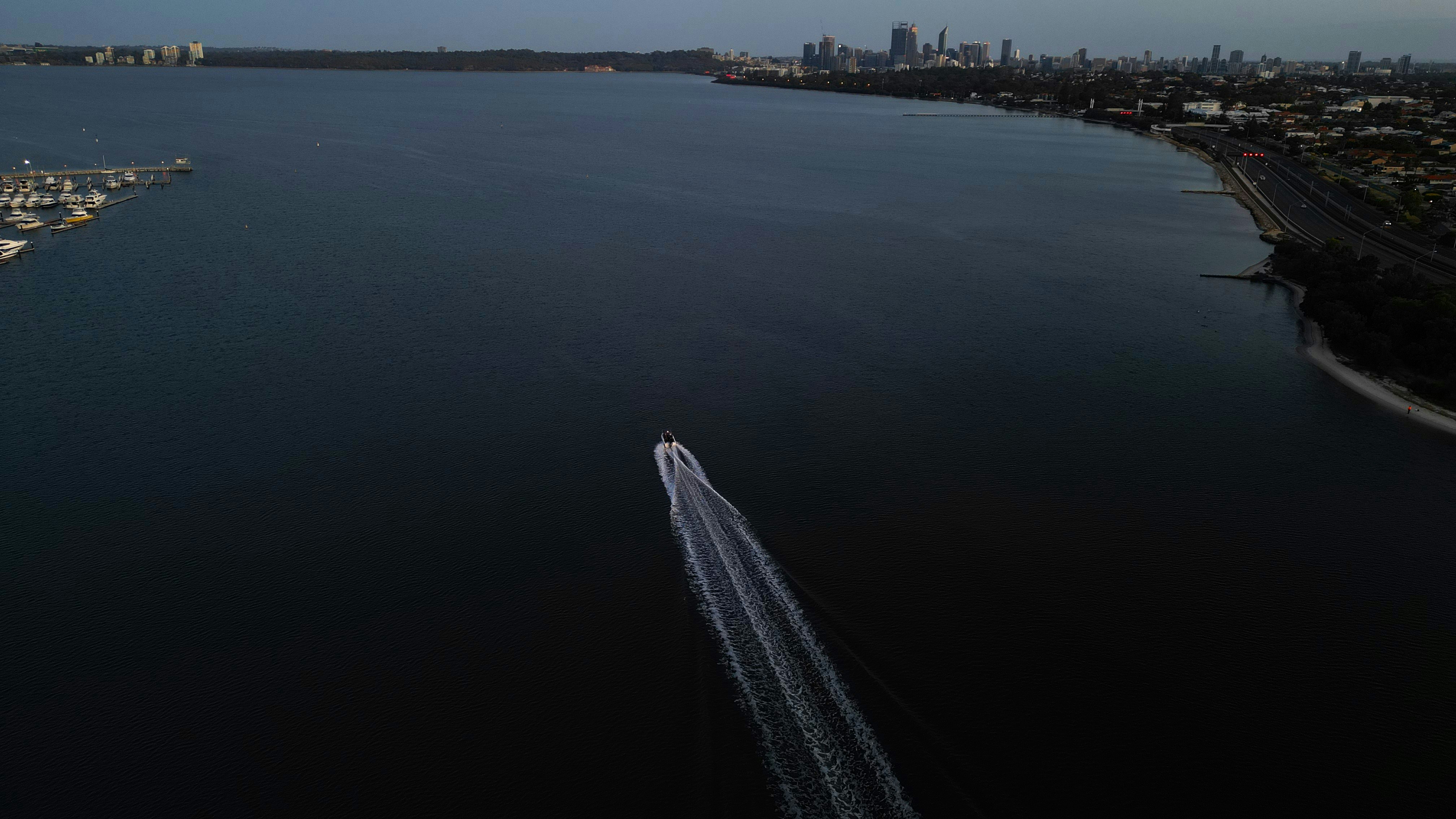 an aerial view of a boat in the water