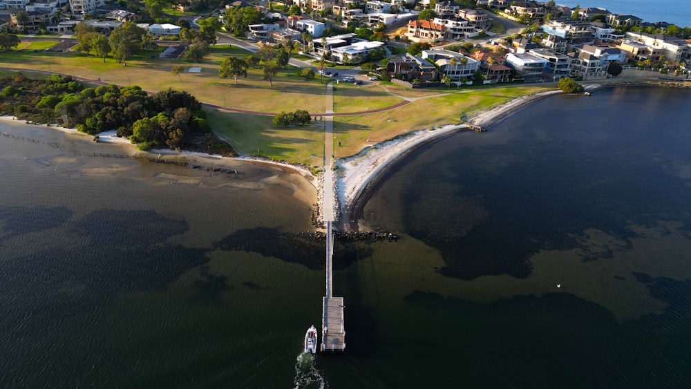 a large body of water with a long pier in the middle of it