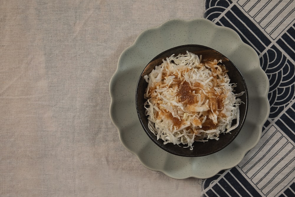 a bowl of food on a plate on a table