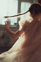 A little girl twirling in a lightweight, patterned dress perfect for special occasions.