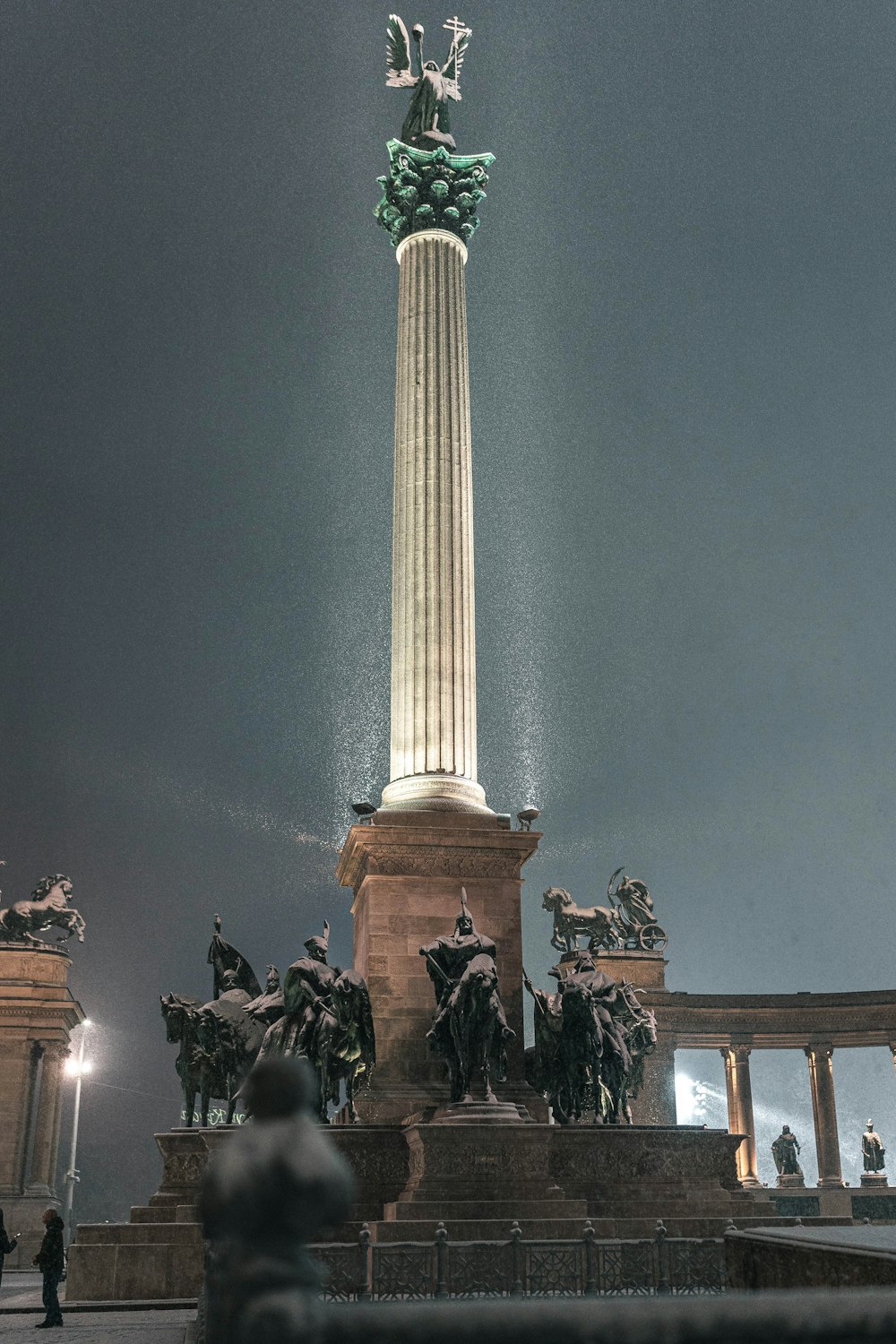 a statue of a man on top of a pillar