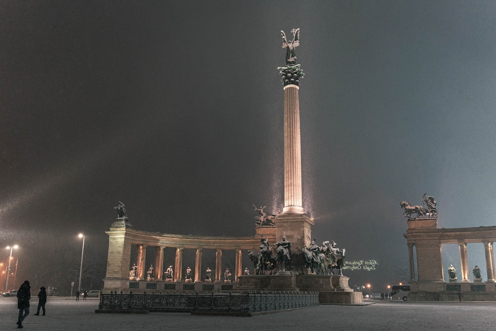 a large monument with a statue on top of it