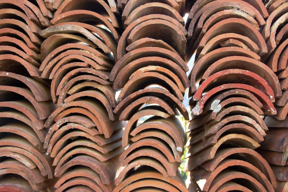 a close up of a stack of clay tiles