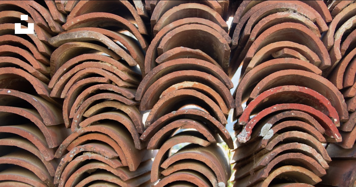A close up of a stack of clay tiles photo – Free Roof tiles Image on ...
