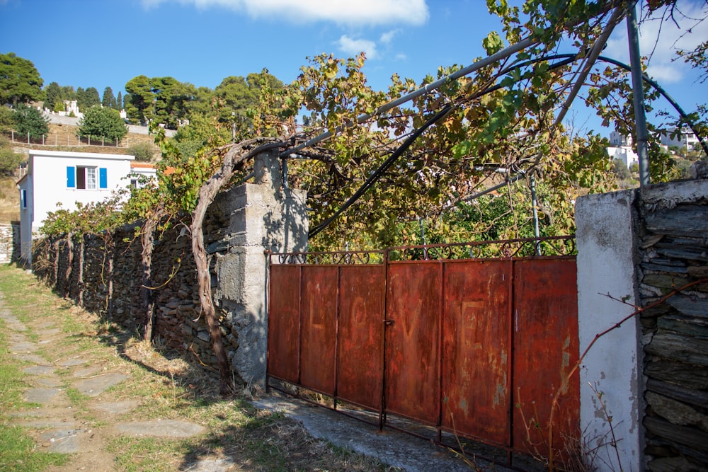 a wooden fence next to a stone building