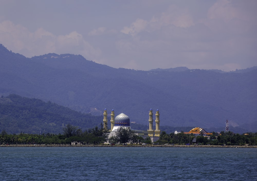 a view of a large building in the middle of a lake