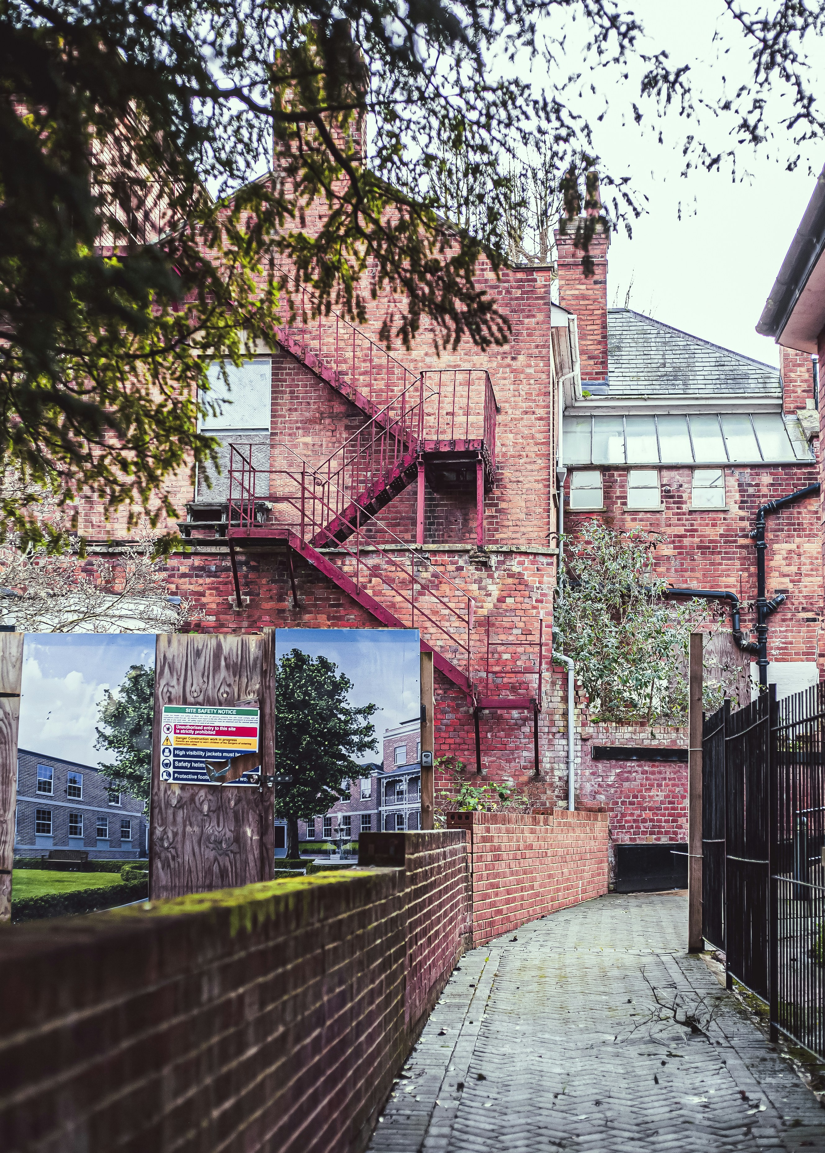 a brick building with a staircase leading up to it