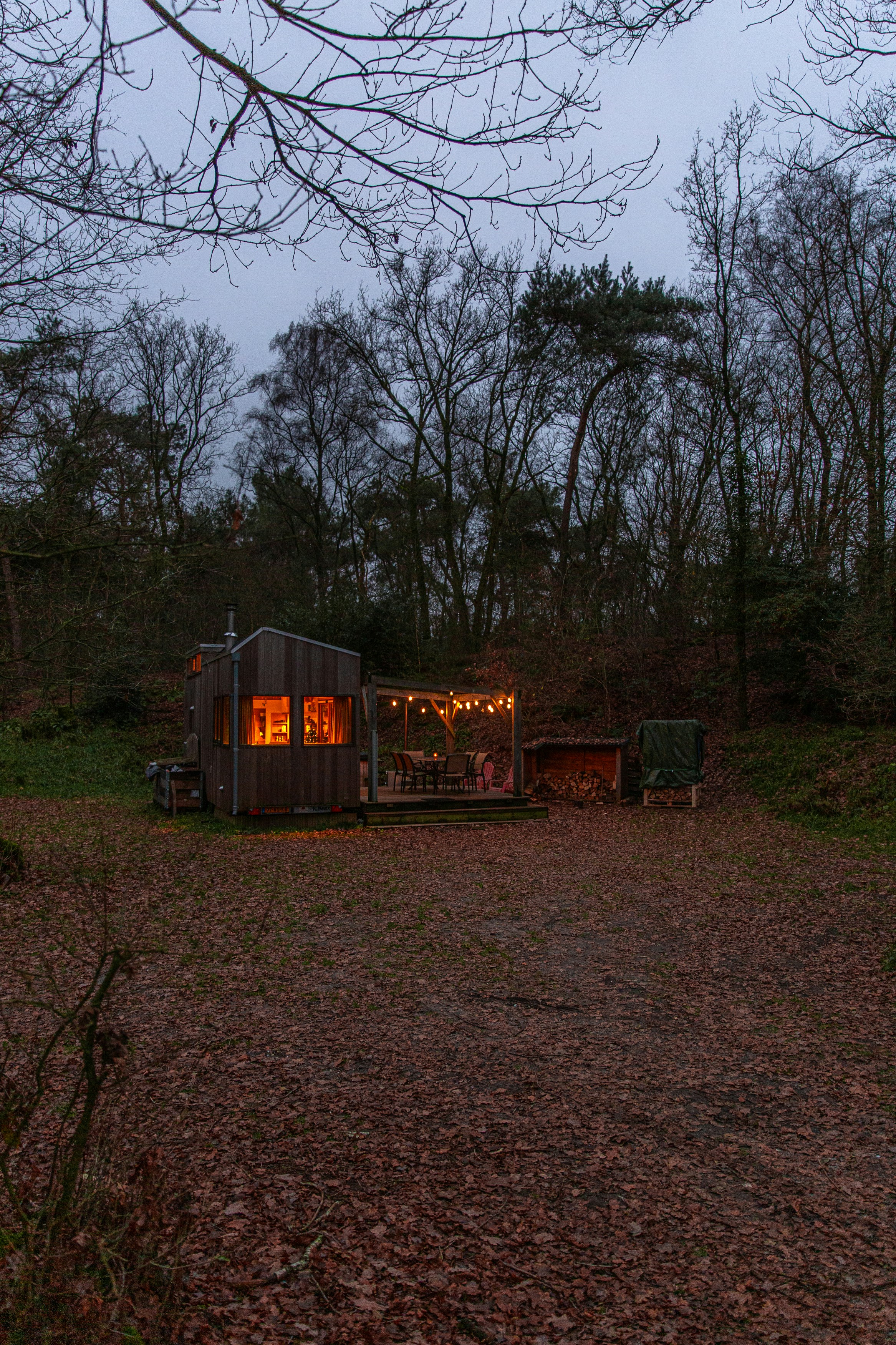 Compact home with a deck in a wooded setting used as an illustrative placement reference