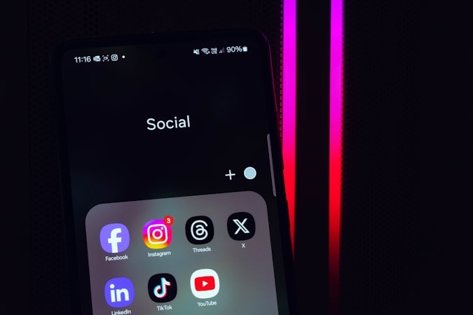 Close-up of a phone screen with popular social media app icons