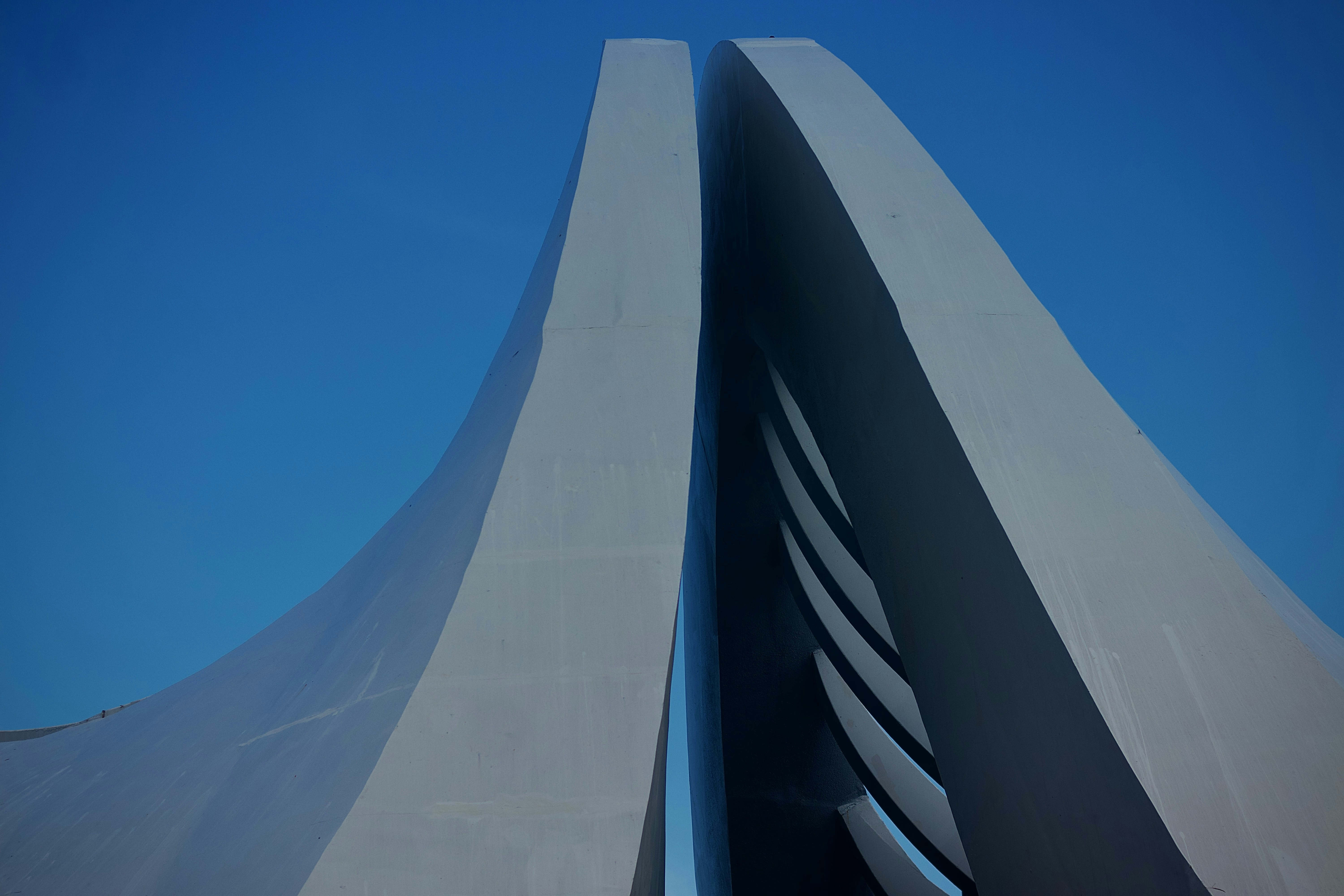 a very tall building with a blue sky in the background