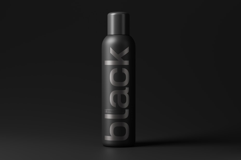 a bottle of deodorant on a black background