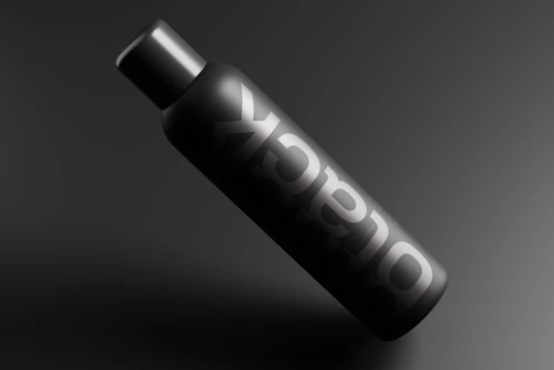 A sleek black matte packaging with subtle foil stamping highlighting the brand logo.