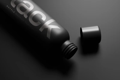 Elegant matte black bottle of hydrating neem face wash with gold accents on a smooth black surface