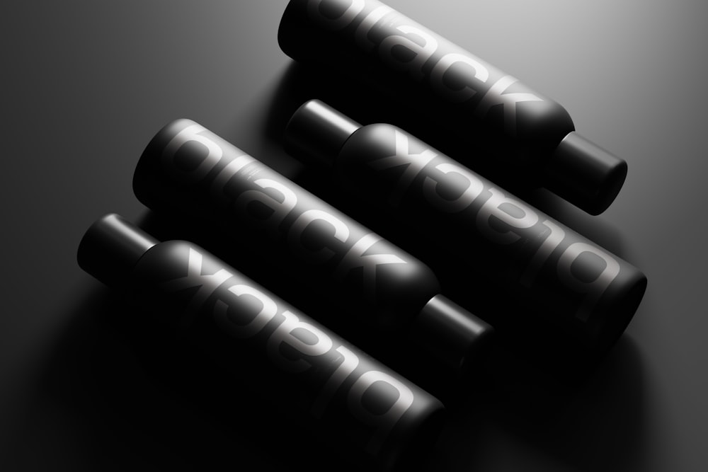 a group of black batteries sitting on top of a table