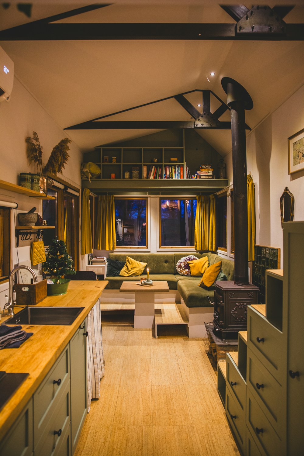 a living room with a couch a table and a window