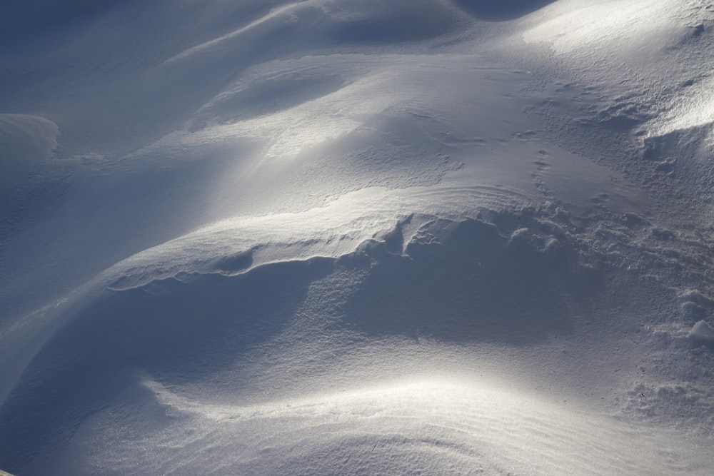 a view of a snow covered slope from a ski lift