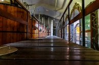 a long wooden walkway leading to a building