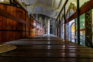 a long wooden walkway leading to a building