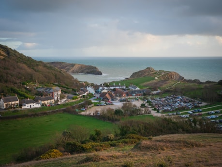 a view of lulworth cove parking by the sea