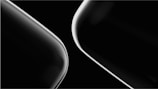 Two sleek, curved lines in a minimalist black and white composition, showcasing a modern and abstract design.