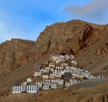 a very tall mountain with a bunch of buildings on top of it