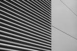 a black and white photo of the side of a building