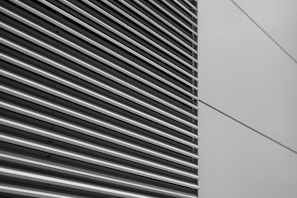a black and white photo of the side of a building