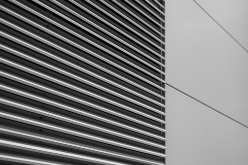 a black and white photo of the side of a building