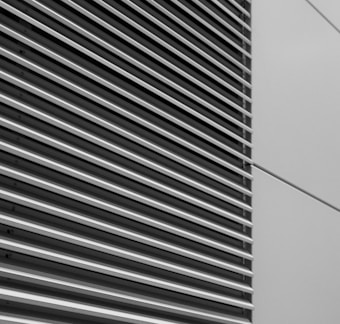 a black and white photo of the side of a building