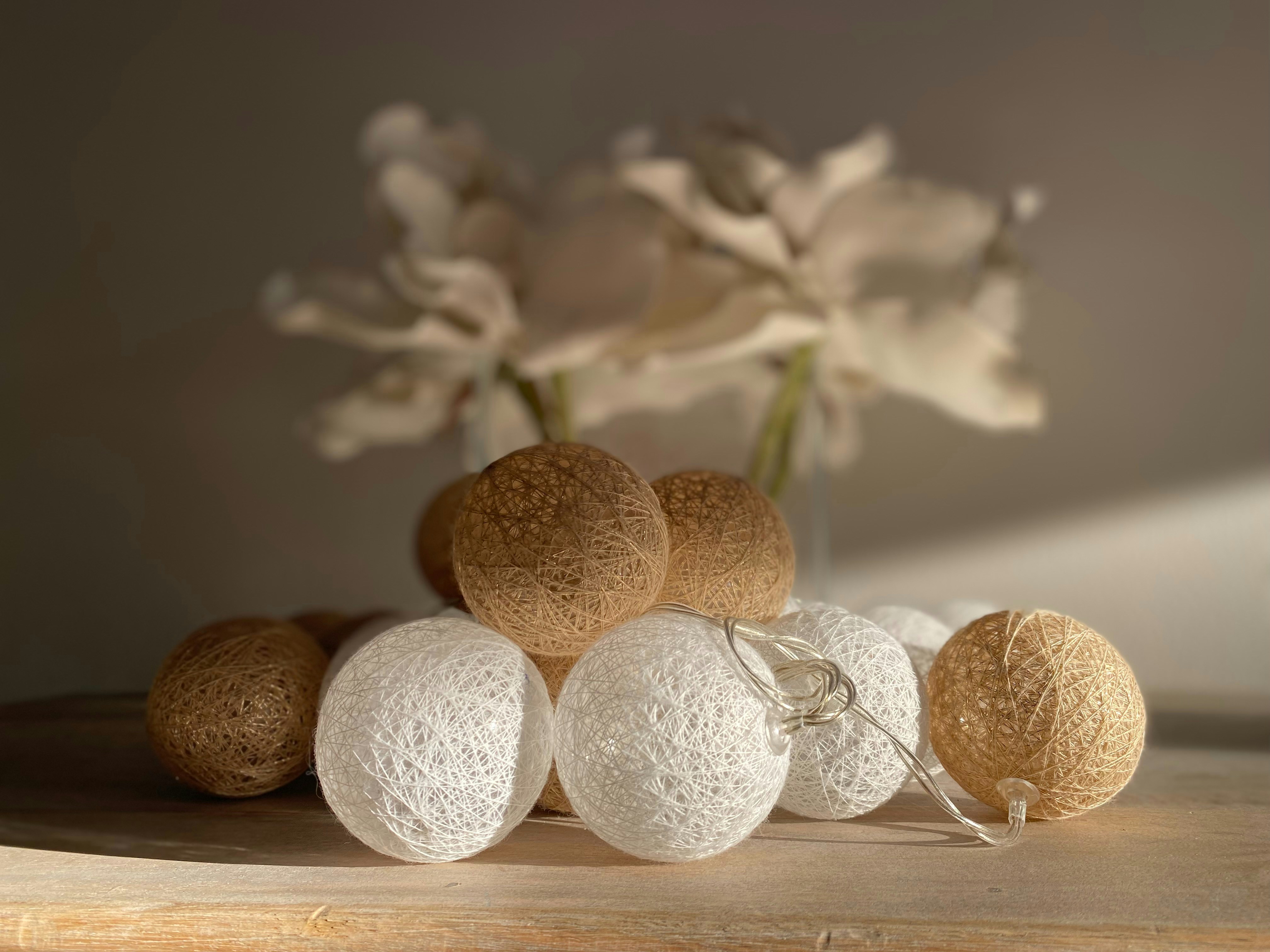 A bunch of balls sitting on top of a wooden table photo – Free Food ...