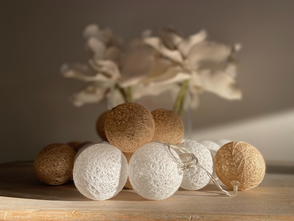 a bunch of balls sitting on top of a wooden table