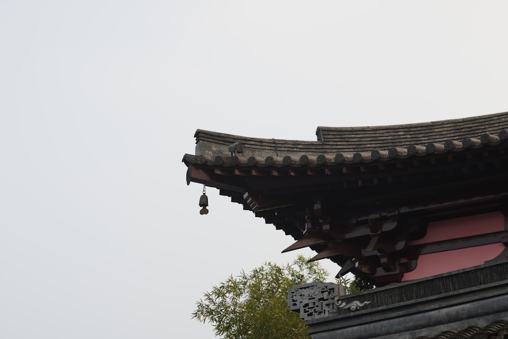 a tall building with a bell on top of it