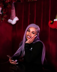 A friendly customer support agent with a headset in front of a purple-themed background.