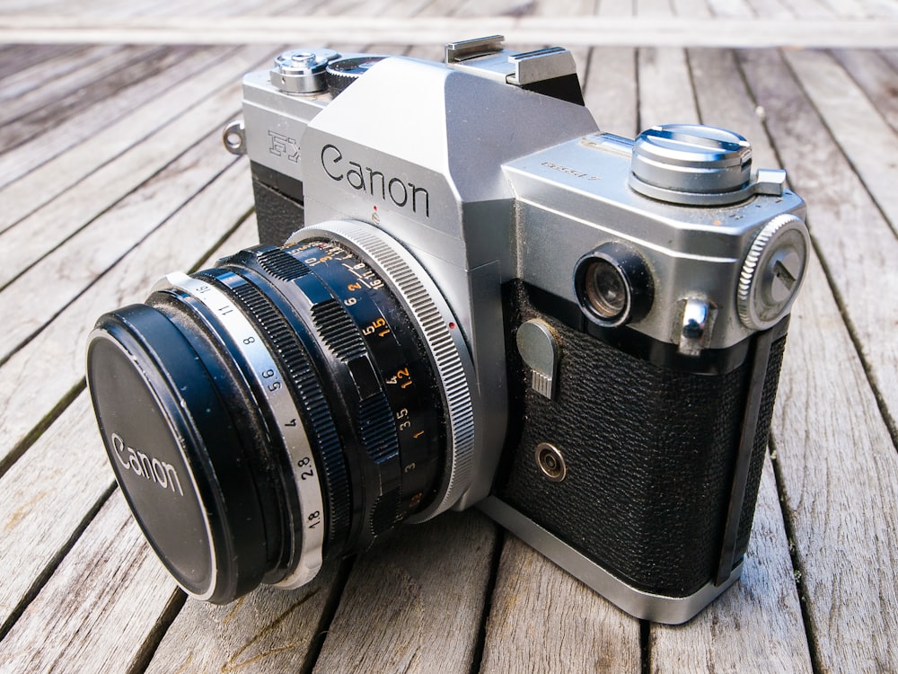 a close up of a camera on a wooden surface