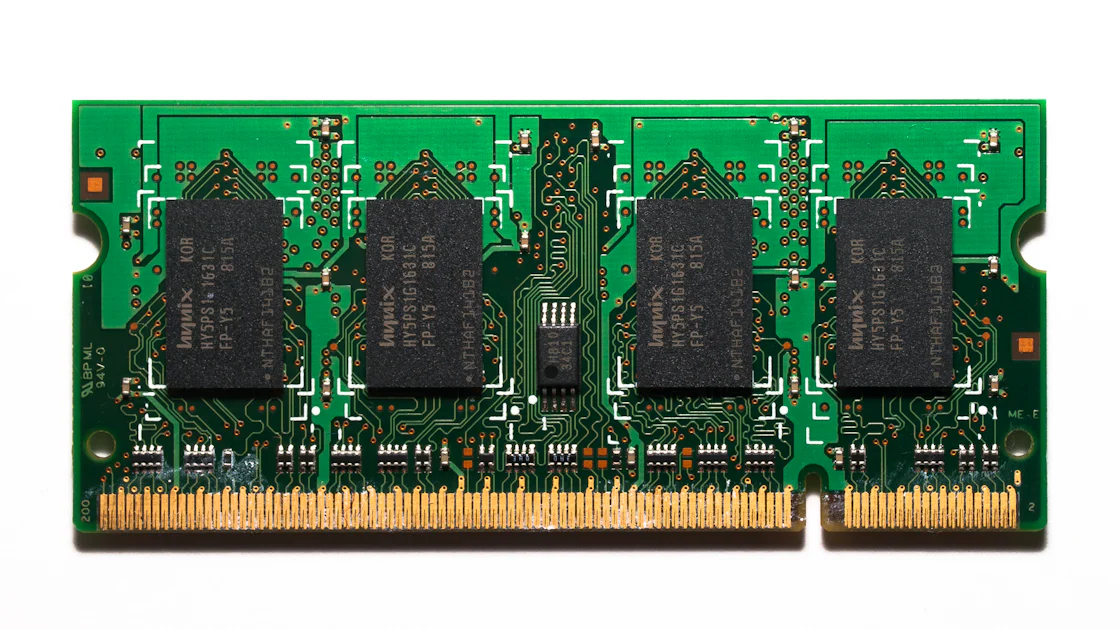 Close-up of a computer memory RAM module on a white surface