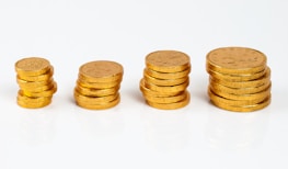 Stack of coins and financial graphs