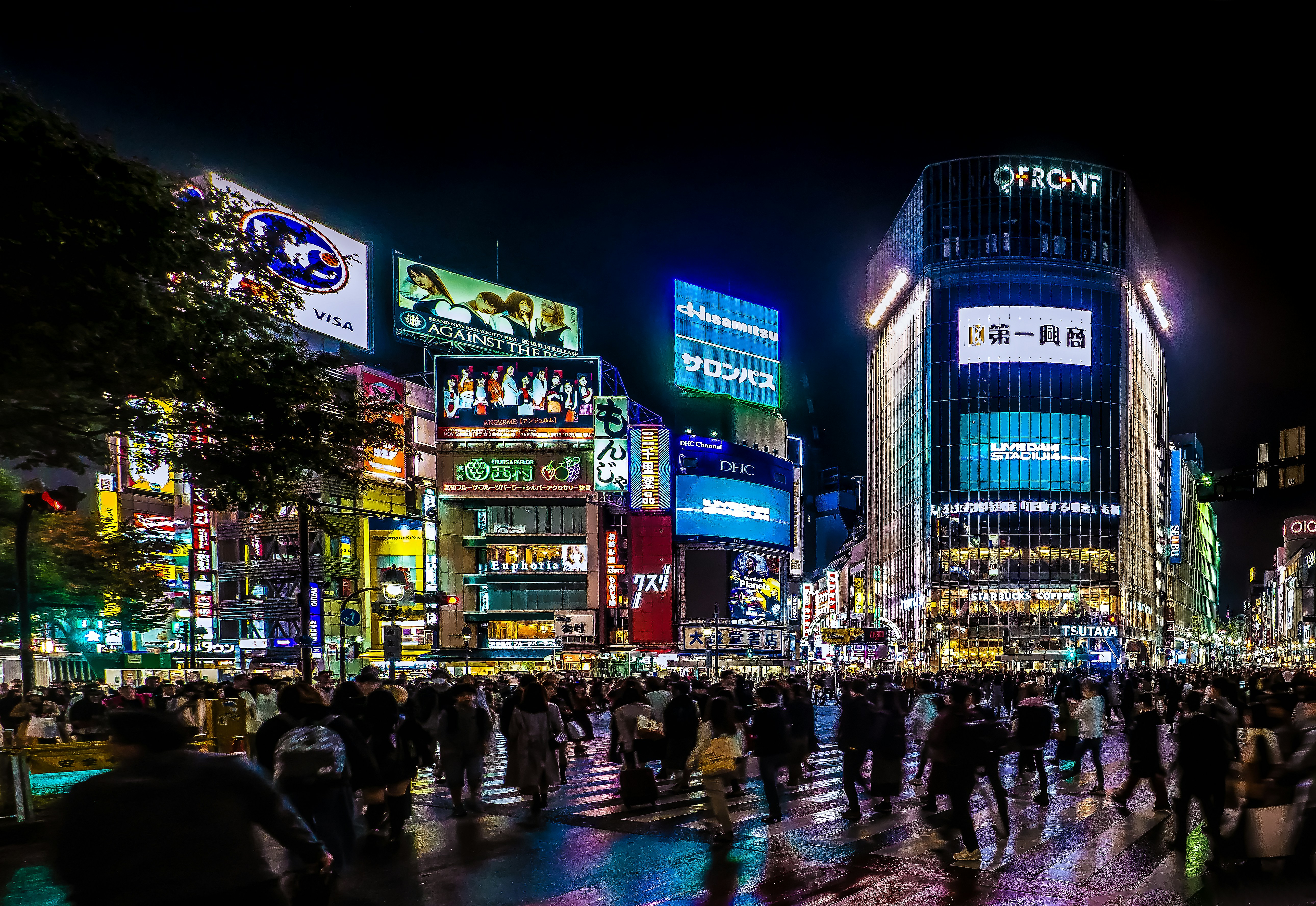 a crowd of people walking across a street at night, Shibuya Crossing