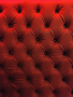 Close-up of a luxurious tufted rug with rich textures and elegant patterns.