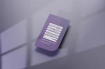 Close-up of a business card and logo with warm, inviting colors reflecting the Vivalar brand.