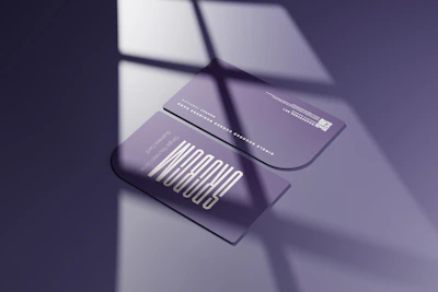 Close-up of a sleek QR business card with a vibrant design on a wooden desk.