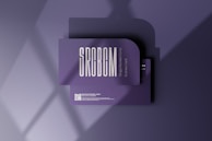 A business card mockup with a rounded corner design placed on a purple surface. The card features bold, modern typography with the text 'SRCBCM' prominently displayed. Light and shadow effects create a stylish and professional atmosphere.