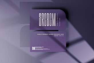 a purple business card with a shadow on it