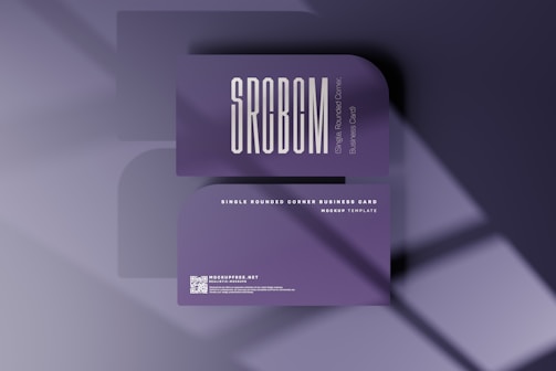 a purple business card with a shadow on it