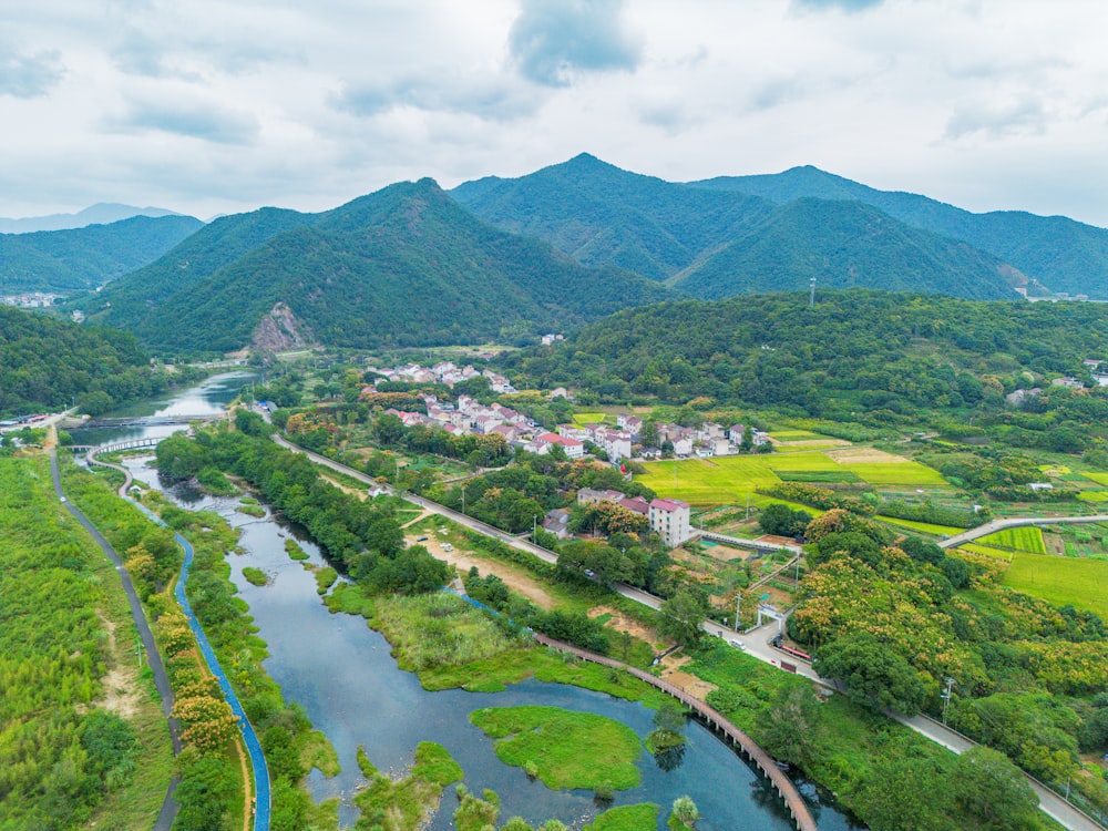 a river running through a lush green countryside