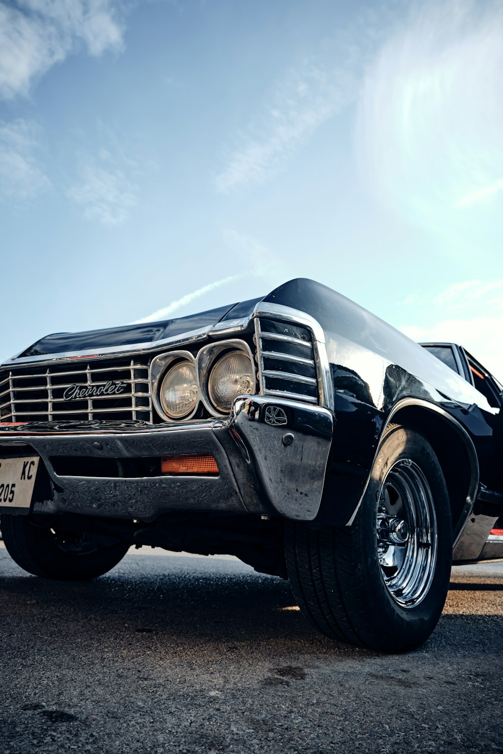 a black car parked on the side of the road