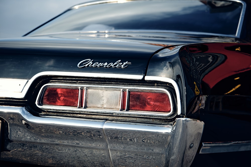 a close up of the rear end of a classic car