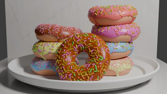 A stack of colorful vegan donuts with different flavors displayed on a bright counter
