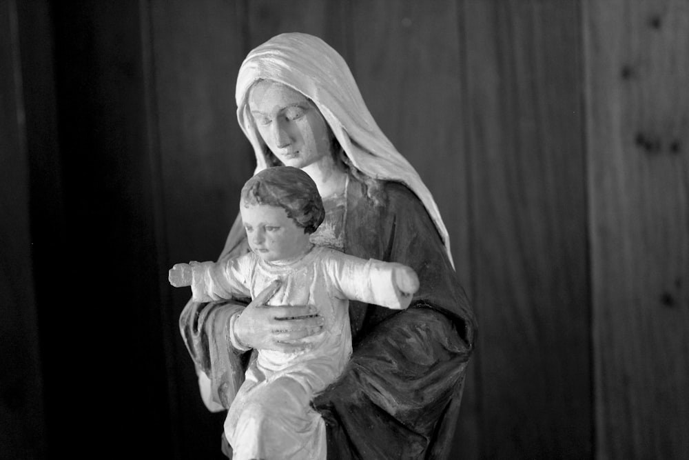 a statue of a woman holding a child