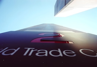 a tall building with the word trade center on it
