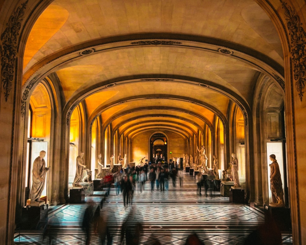 a group of people that are standing in a hallway